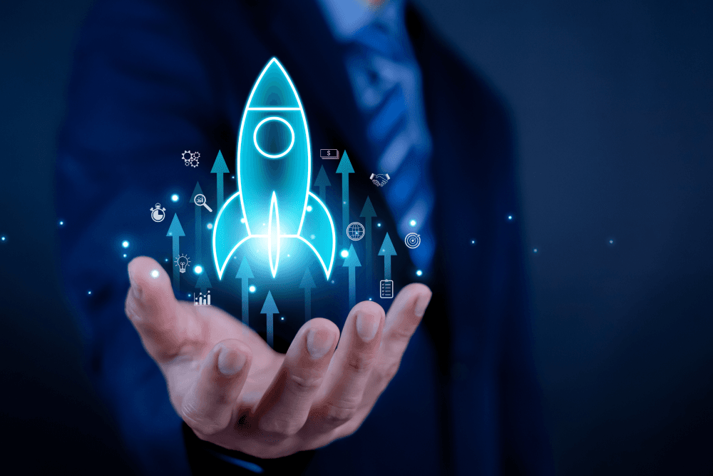 A rocket ship lifts off out of an outstretched hand
