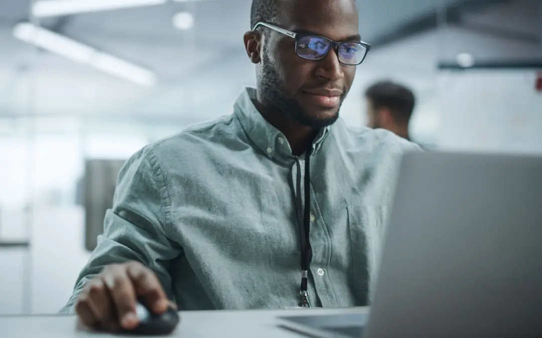 Man working on desktop computer.