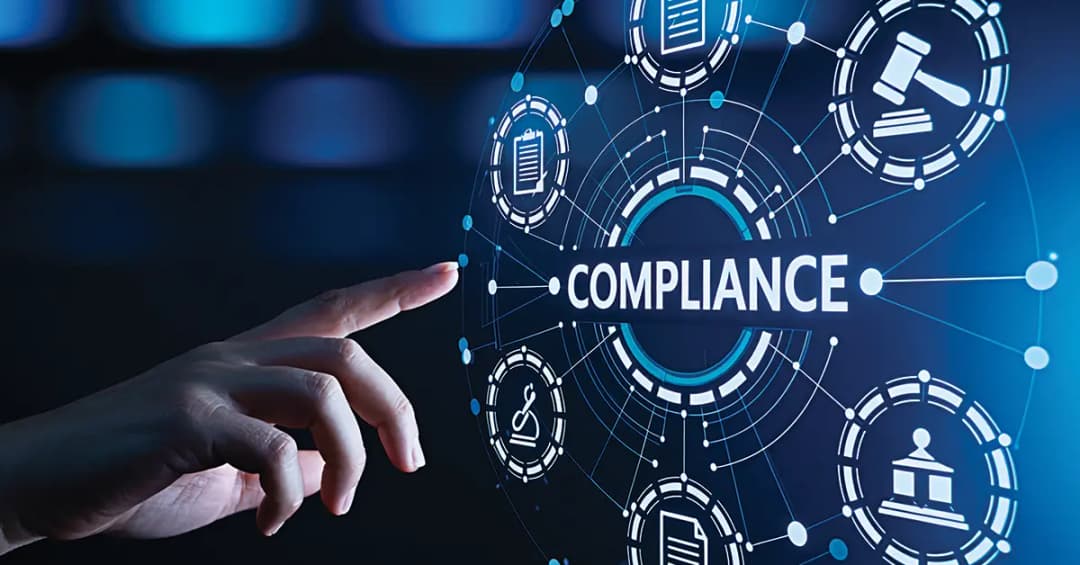 Color photo illustration with finger pressing button labeled "Compliance."