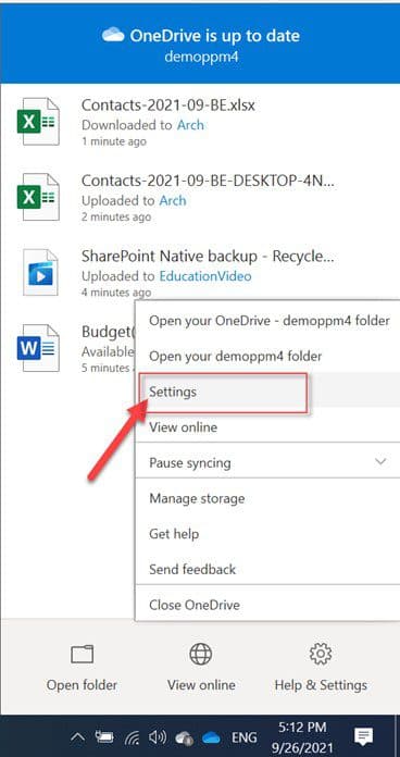 OneDrive settings menu with arrow pointing to Settings