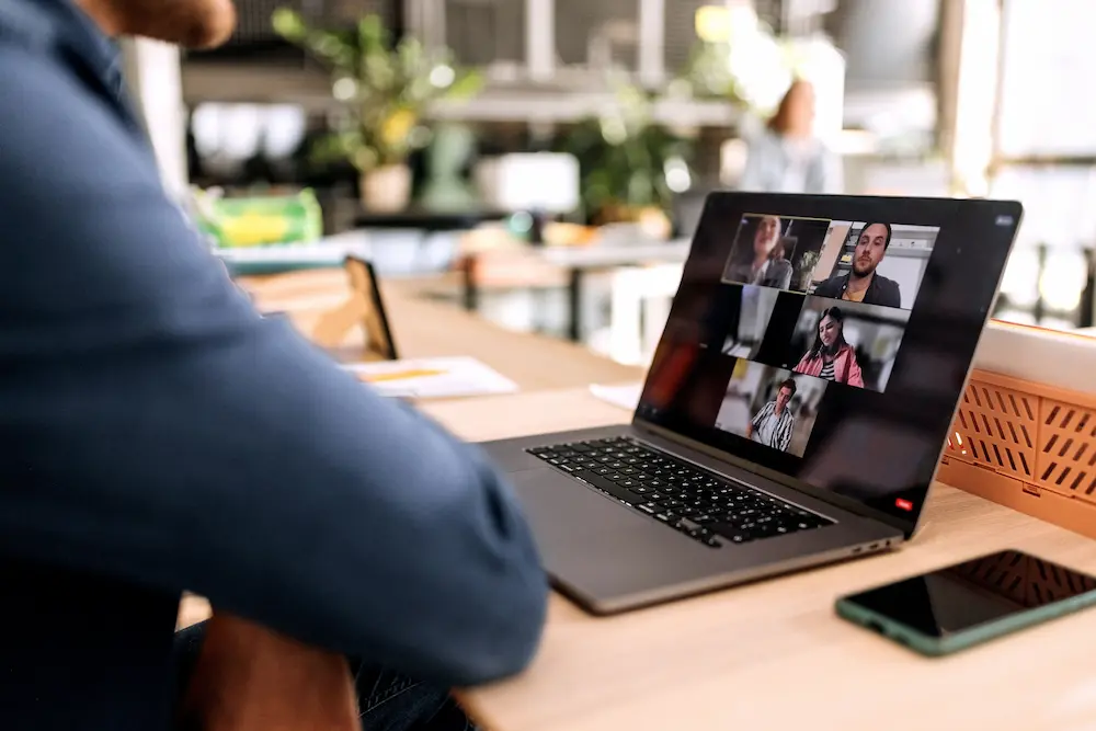 Person viewing laptop screen.