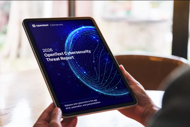 Photo of hands holding tablet PC that is displaying threat report cover page.