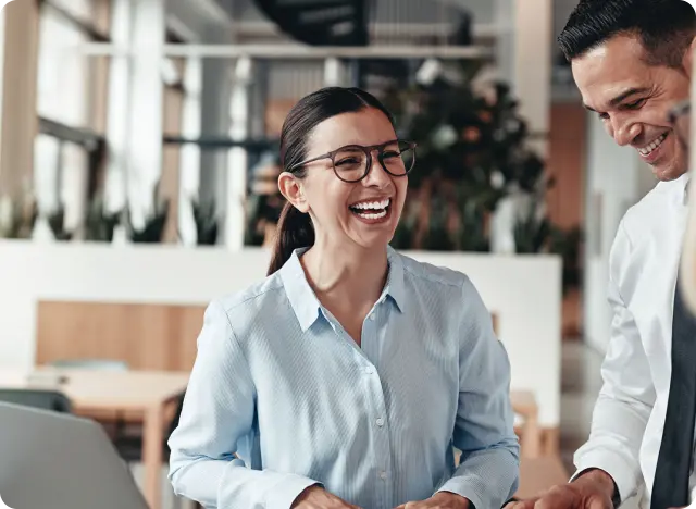 2 coworkers smiling