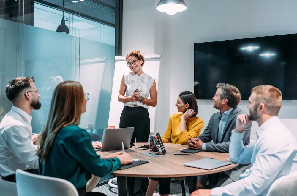 Woman leading meeting in conference room.